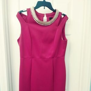 Red sleeveless jeweled thigh length dress.